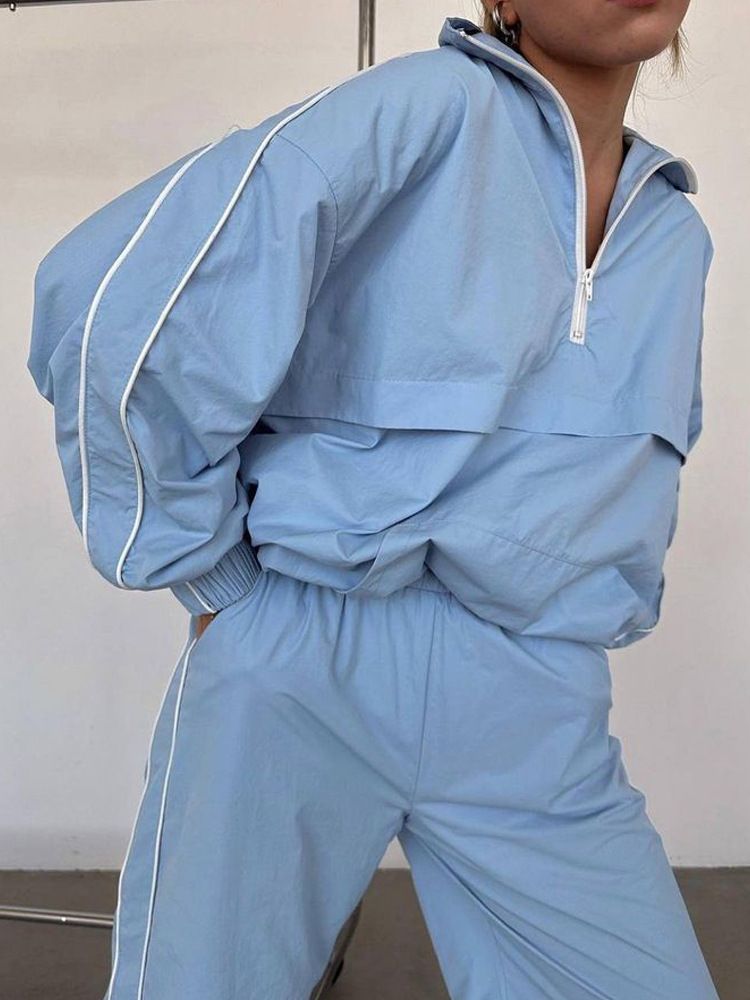 Felpa con maniche a righe alla moda da donna e set casual con cerniera e pantaloni lunghi per le donne_voghion.com