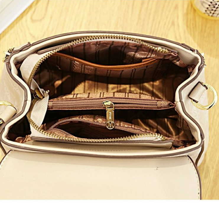 La nuova borsa a tracolla da donna a quadri di quest'anno è popolare su Internet, con una versatile tracolla stampata e alla moda e_voghion.com