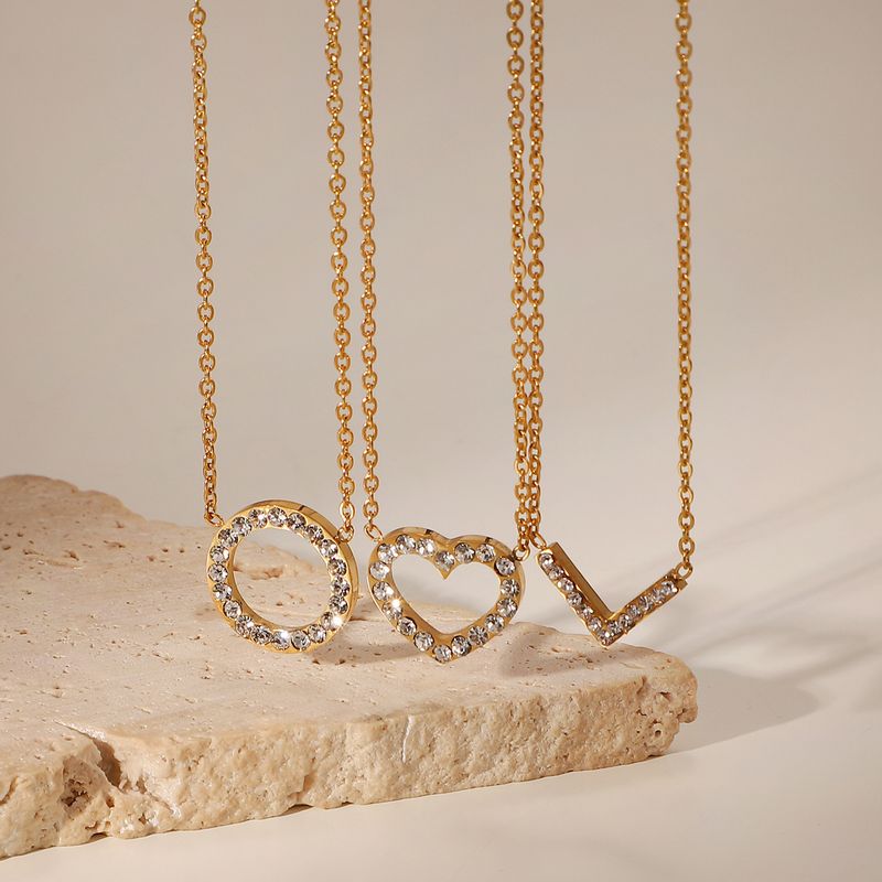Collana con ciondolo in zirconia cubica con collare in acciaio inossidabile dorato a forma di cuore circolare geometrico cavo per donna_voghion.com