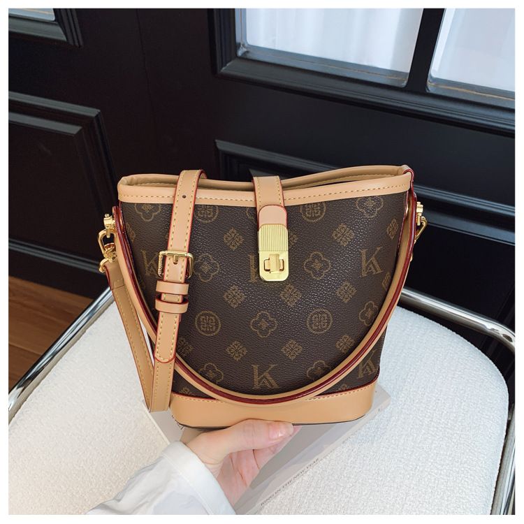 Tendenza di quest'anno: borsa a secchiello leggera e lussuosa stampata per le donne, nuova borsa alla moda 2025, borsa a tracolla versatile_voghion.com