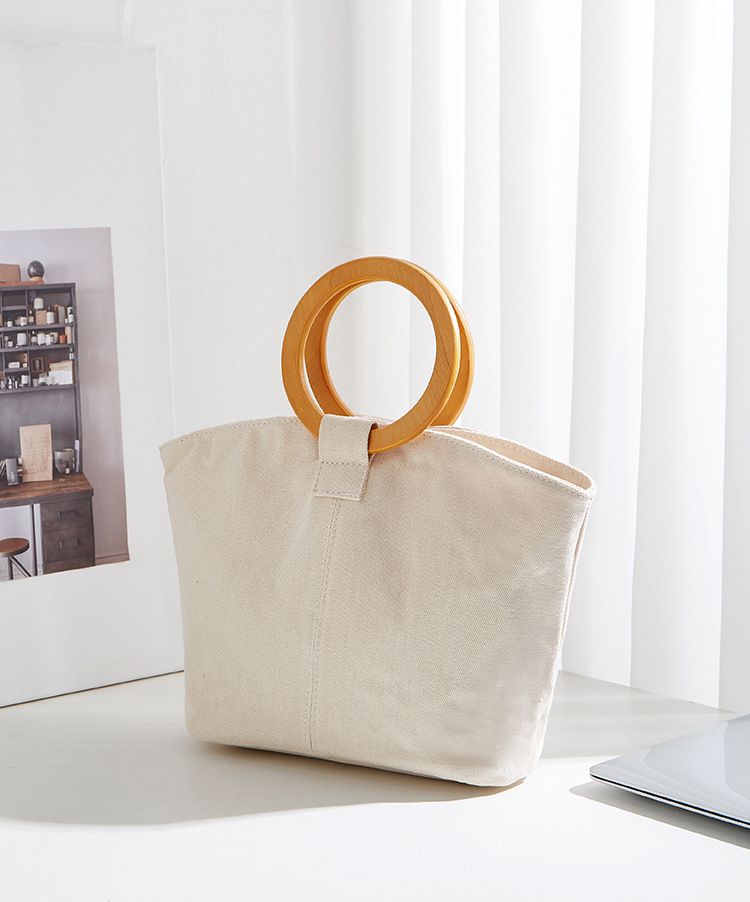 Borsa versatile e di grande capienza in versione coreana, la nuova borsa da donna minimalista in tela di quest'anno, manico in legno_voghion.com