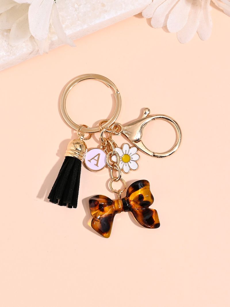 Porte-clés avec pompon et nœud papillon imprimé léopard, nouvelle mode, mignon, pendentif pour sac_voghion.com
