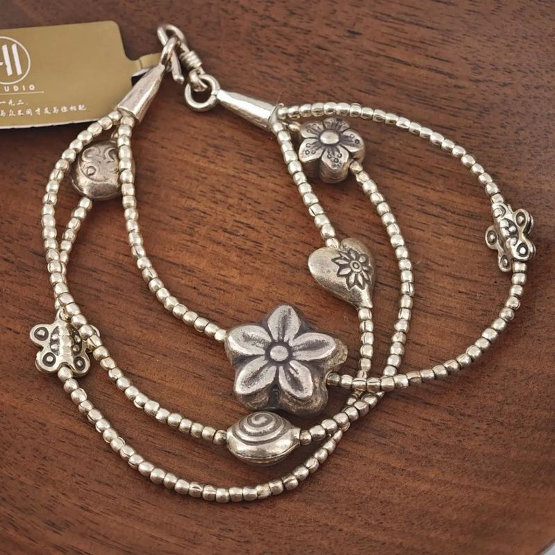 Braccialetto di perline a barilotto in corda di cera cubana vintage intrecciata in argento puro fatto a mano a Chiang Mai, Thailandia_voghion.com