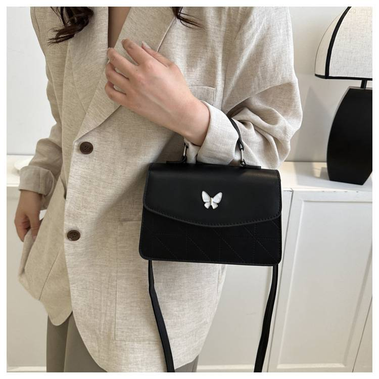 Fransk lyxig handväska i mild stil Butterfly Dekorativ liten väska Dam 2024 Sommar Ny västerländsk stil Crossbody-väska med en axel_voghion.com