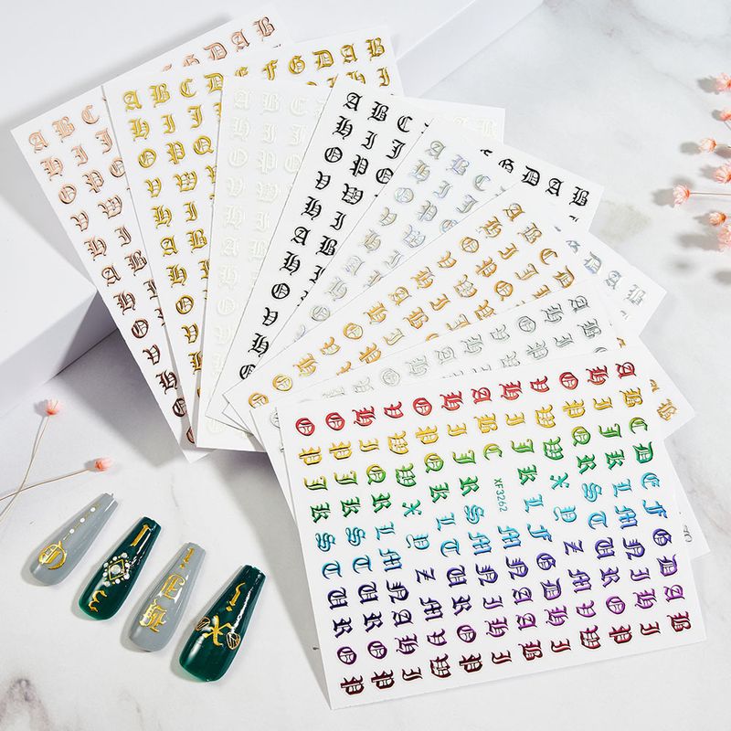 Nail art olografiche oro e argento - Decalcomanie fai da te per nail art con alfabeto gotico, adesivi unici_voghion.com