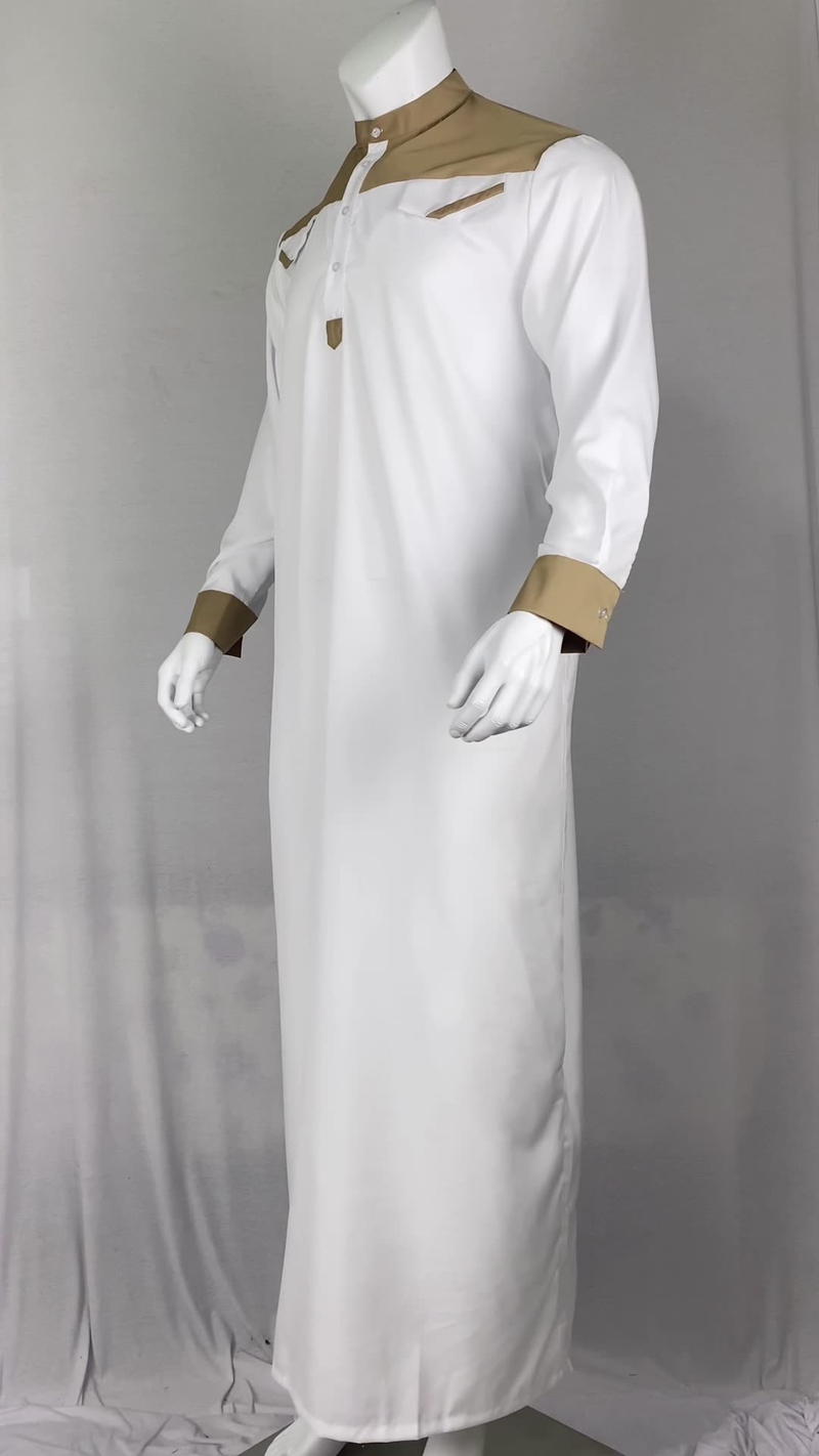 Die neue muslimische Herrenbekleidung für Herbst und Winter 2025 zeichnet sich durch einen lockeren Stehkragen im orientalischen Stil und ein langärmeliges Gewand im Farbblockdesign im Ethno-Stil aus_voghion.com