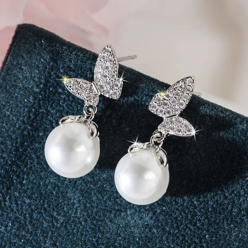 Il puzzle d'amore minimalista con farfalle di perle di Cao Shi, orecchini di drenaggio abbinati al tramonto, orecchini in stile coreano_voghion.com