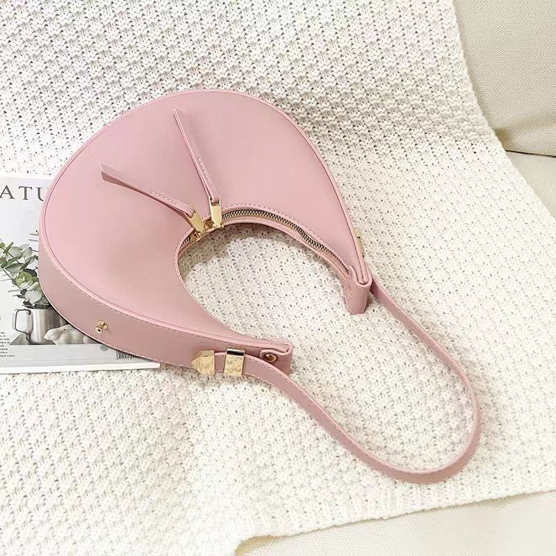 La nuova borsa di nicchia di quest'anno, borsa a mezzaluna a mezzaluna con spalla singola e ascellare di fascia alta da donna_voghion.com