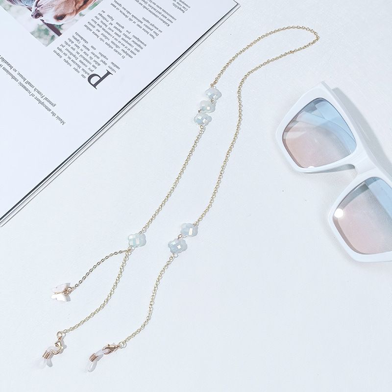 Cadena para gafas sencilla con máscara de retención de color dorado y trébol de cuatro hojas de alta gama._voghion.com