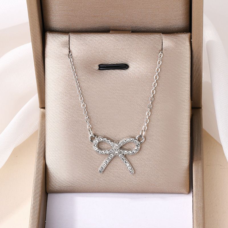 Collana con ciondolo a forma di fiocco in lega di diamanti, con catena per maglione da donna_voghion.com