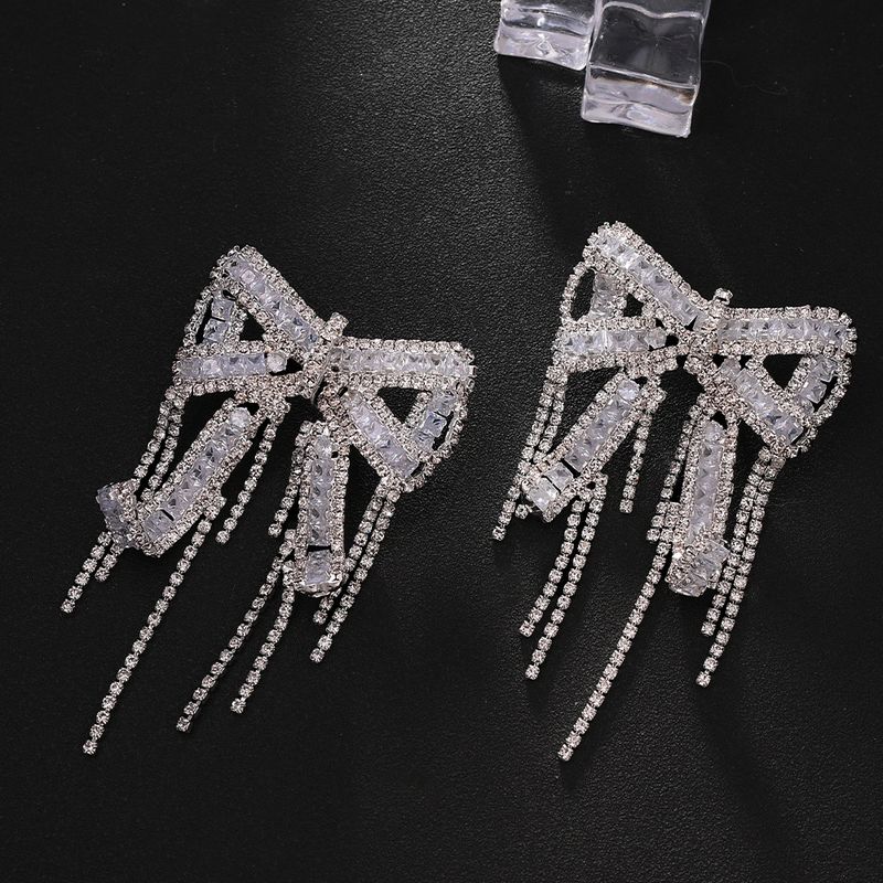 Orecchini con fiocco e nappa, design a clip, orecchini con strass, orecchini squisiti e alla moda_voghion.com