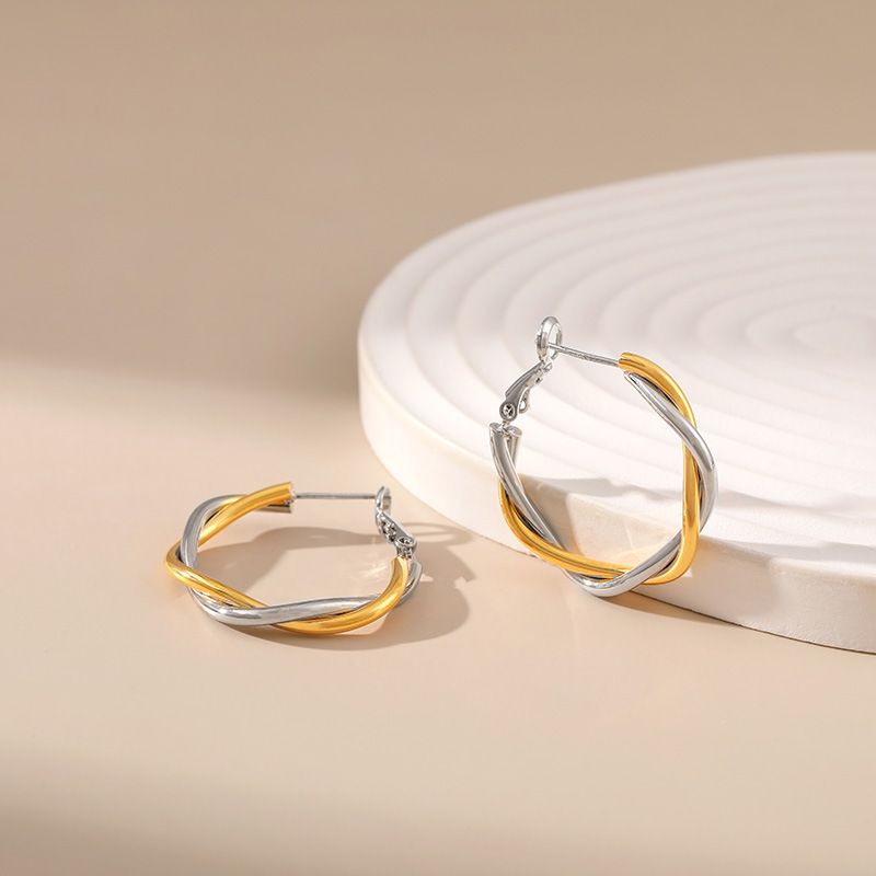 Gold and silver contrasting design personality earrings K real gold plated niche metal texture cross twist earrings_voghion.com