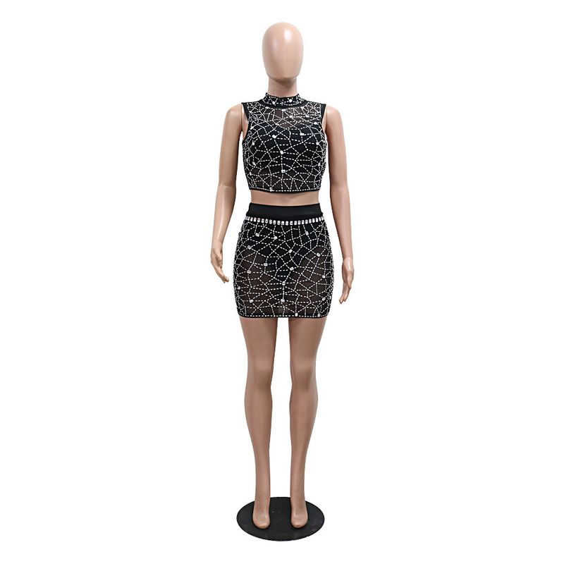 Completo due pezzi in rete con paillettes - Top corto con scollo tondo e minigonna aderente con lingerie_voghion.com