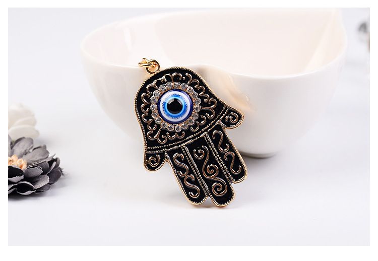 Portachiavi creativo a forma di palma con occhio di demone dagli occhi blu_voghion.com