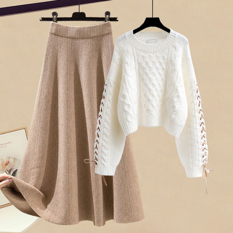 Completo da donna con maglione lavorato a maglia e gonna midi: outfit autunno-inverno alla moda, elegante e snellente in due pezzi_voghion.com