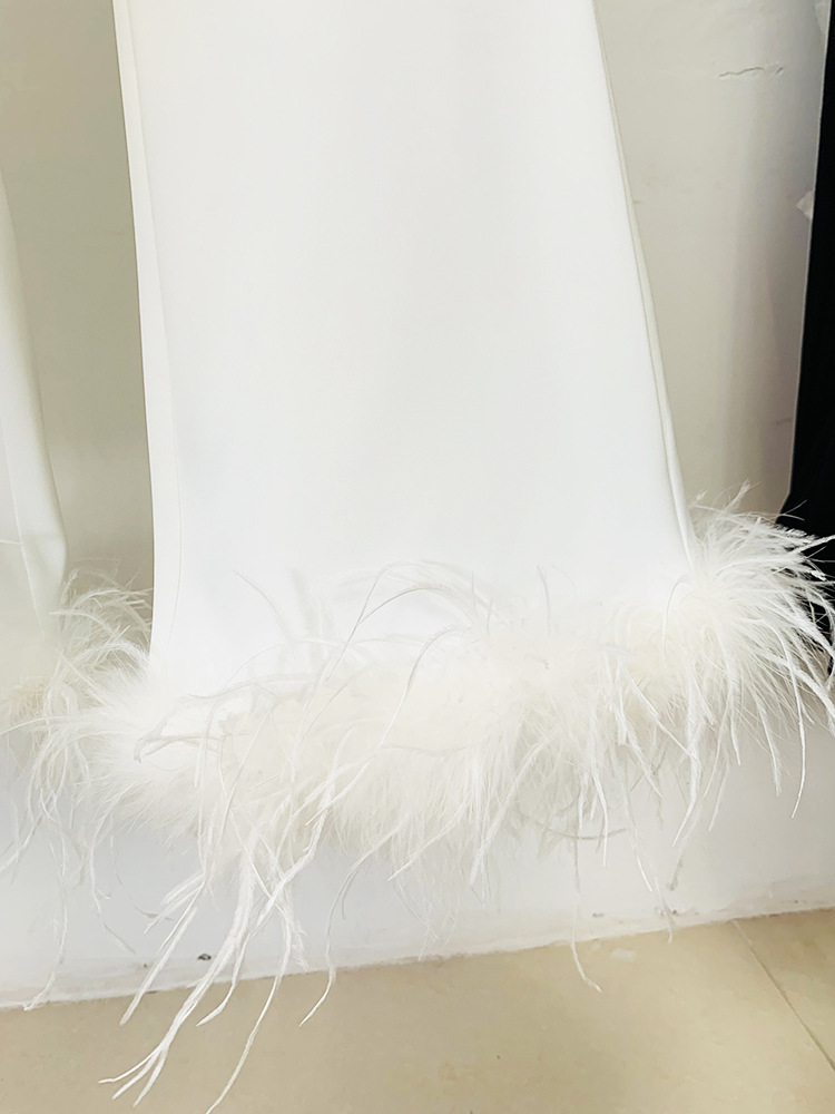 Giacca da donna in vera pelliccia di struzzo con piume e tailleur pantalone a nove quarti in due pezzi_voghion.com