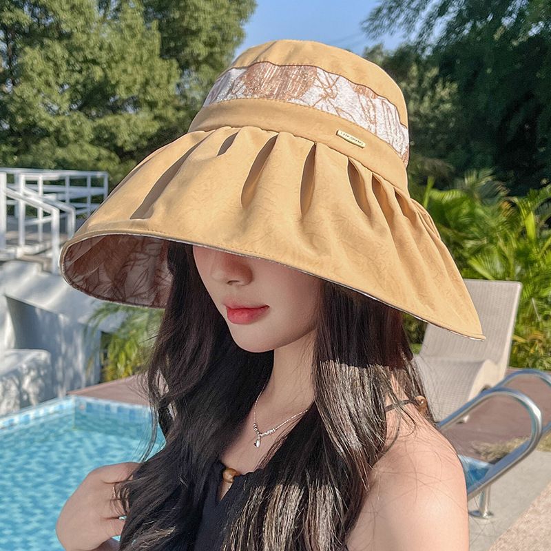 UV-bestendige zonnebril voor dames, veelzijdig in de lente en zomer, met vlinderknoop en een brede rand om het gezicht te bedekken._voghion.com