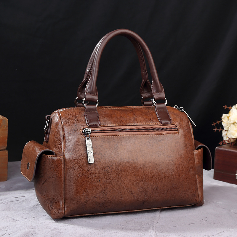 2023 Xiti Paul New Style Crossbody Große Kapazität Handheld Kontrast Kissen Boston Damentasche_voghion.com