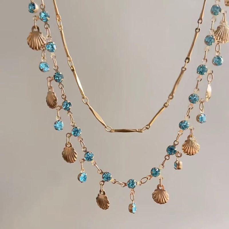 Blaue Muschelhalskette, weiblicher Choker, doppellagig gestapelt, trägt eine exquisite High-End-Nische mit Schlüsselbeinkette_voghion.com