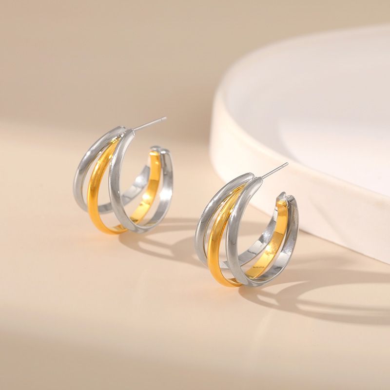 Gold and silver contrasting design personality earrings K real gold plated niche metal texture cross twist earrings_voghion.com