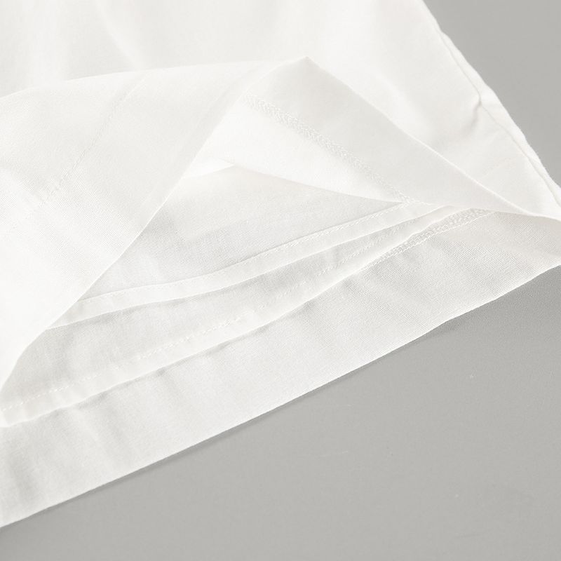 Traje de pantalón corto sin mangas con cuello halter de algodón y lino blanco_voghion.com