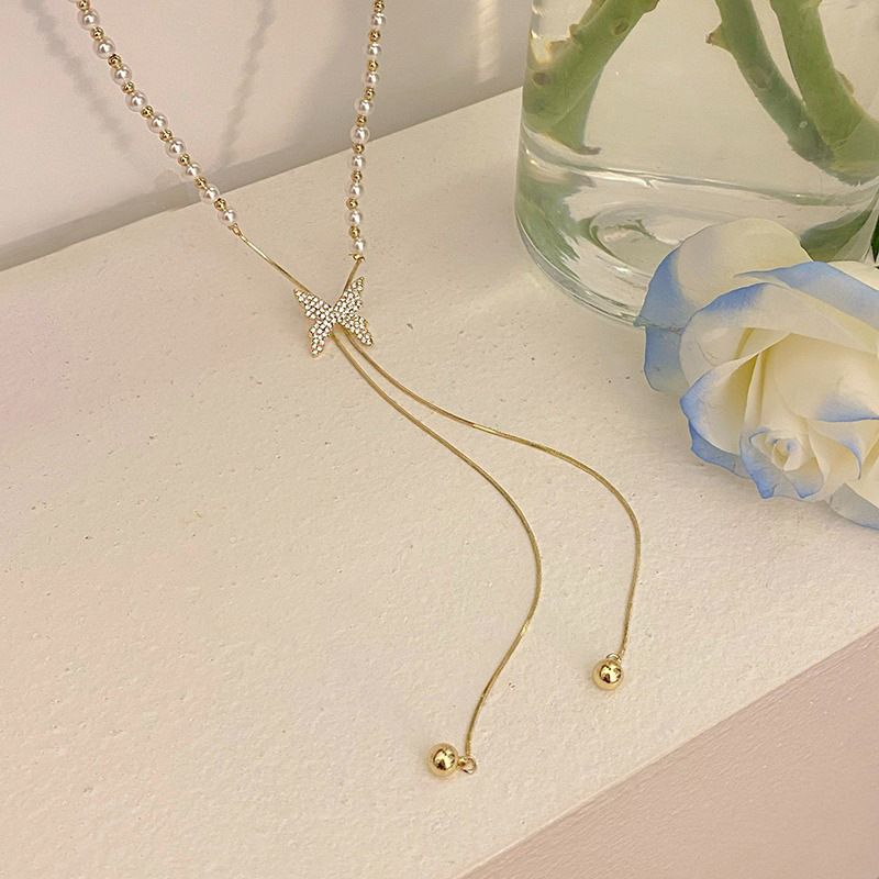 Pearl necklace for women, necklace design, niche butterfly tassel pendant, clavicle chain 2023 new_voghion.com