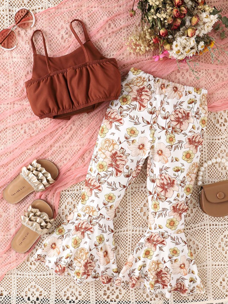 Un set in due pezzi di completi per ragazze vento, primavera ed estate, con bretelle per bambini piccoli, top con fiocco, stampa_voghion.com