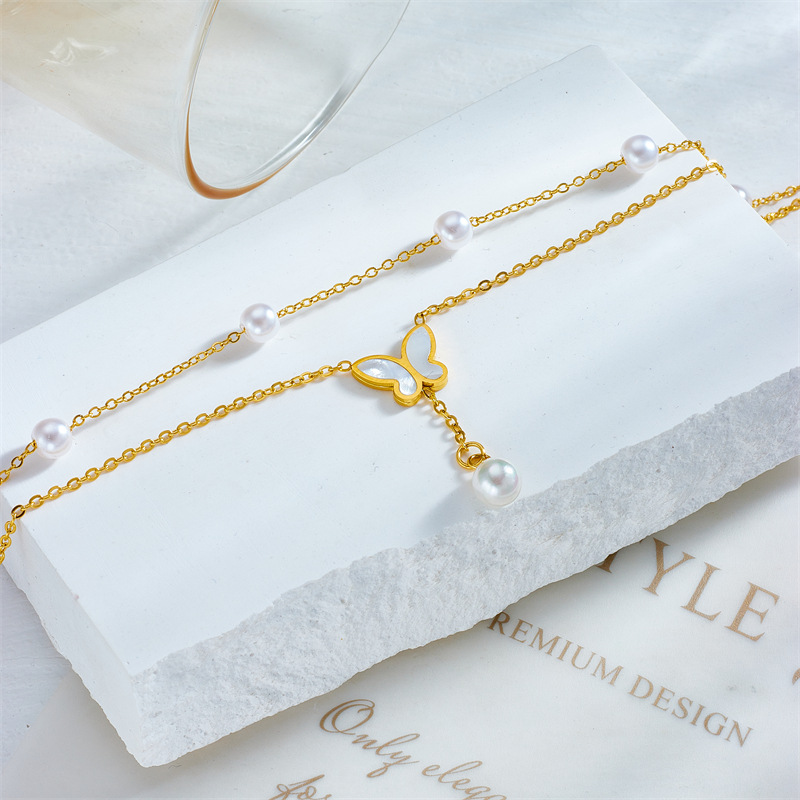 Style coréen tempérament de mode élégant luxe léger multicouche empilable perle papillon gland chaîne titane acier polyvalent bracelet de cheville_voghion.com