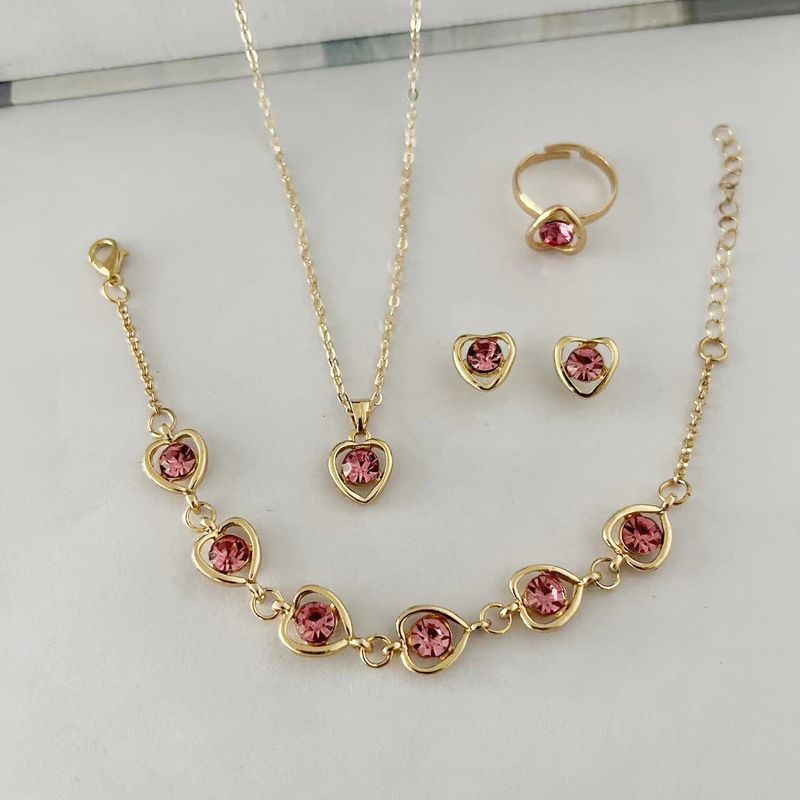 Ensemble de bijoux européens et américains de style nouveau, boucles d'oreilles colorées en forme de cœur creux, ensemble de bijoux pour la main, collier à la mode, ensemble de 4 pièces_voghion.com