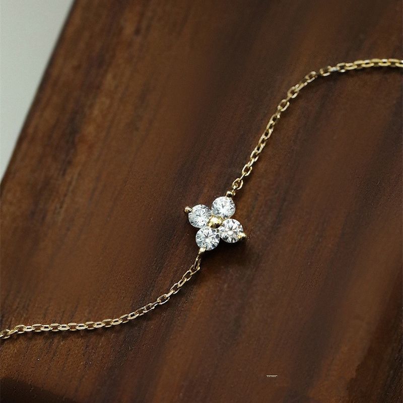 Cavigliera in argento puro con quadrifoglio placcato oro e diamanti intarsiati, lusso di alta gamma, nuovo modello_voghion.com