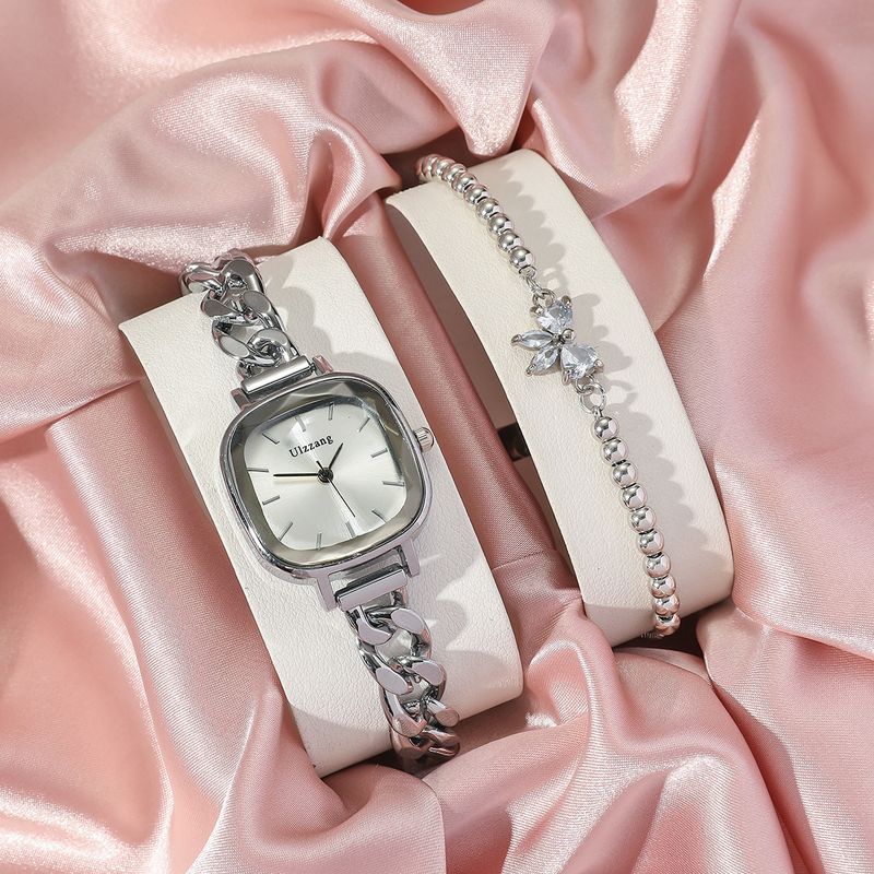 Dameur og smykkesæt med lilla Aurora-urskive og firkantet armbåndsur + armbåndssæt med sommerfuglesten til studerende_voghion.com