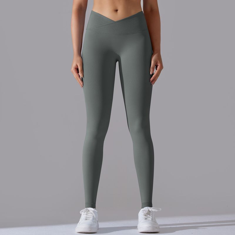 Pantaloni da yoga a nove punti da fitness da donna, lavorati a maglia, traspiranti, in tinta unita, a vita incrociata, color pesca, senza cuciture_voghion.com