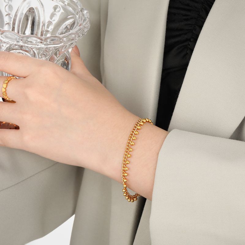 Bracciale con perline rotonde esagerate in stile esotico alla moda per donna con design a nappa, gioielli in acciaio al titanio_voghion.com