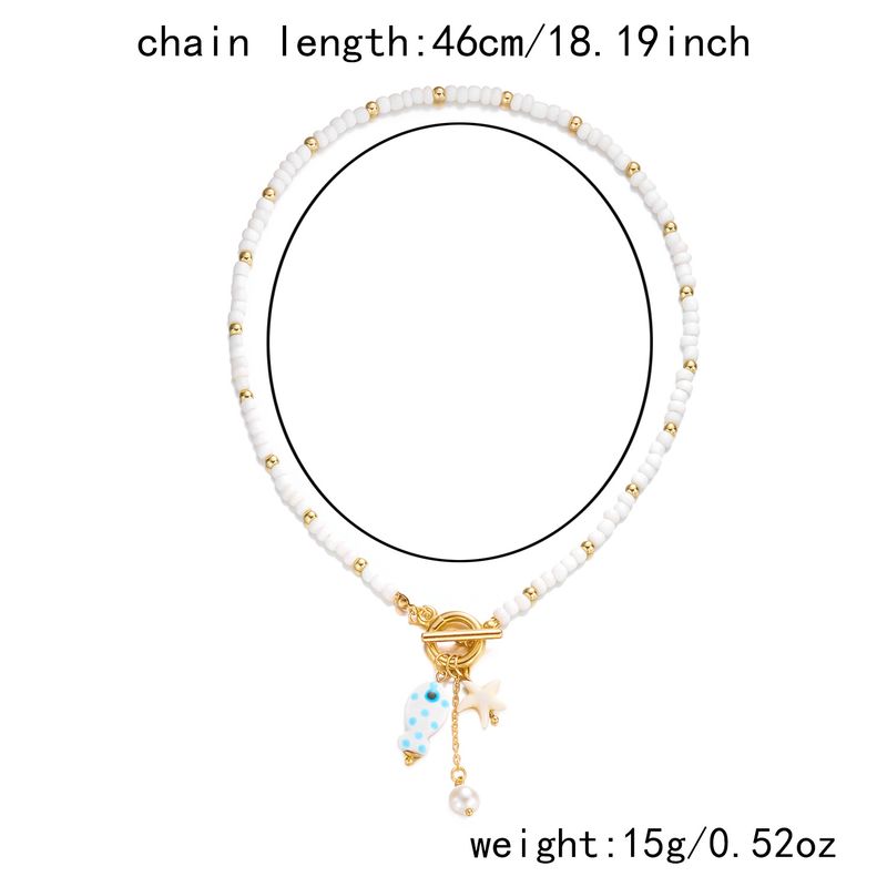 Nouveau collier double rang de perles de riz, pompon en céramique et fermoir OT, orné de petits poissons et d'étoiles de mer._voghion.com