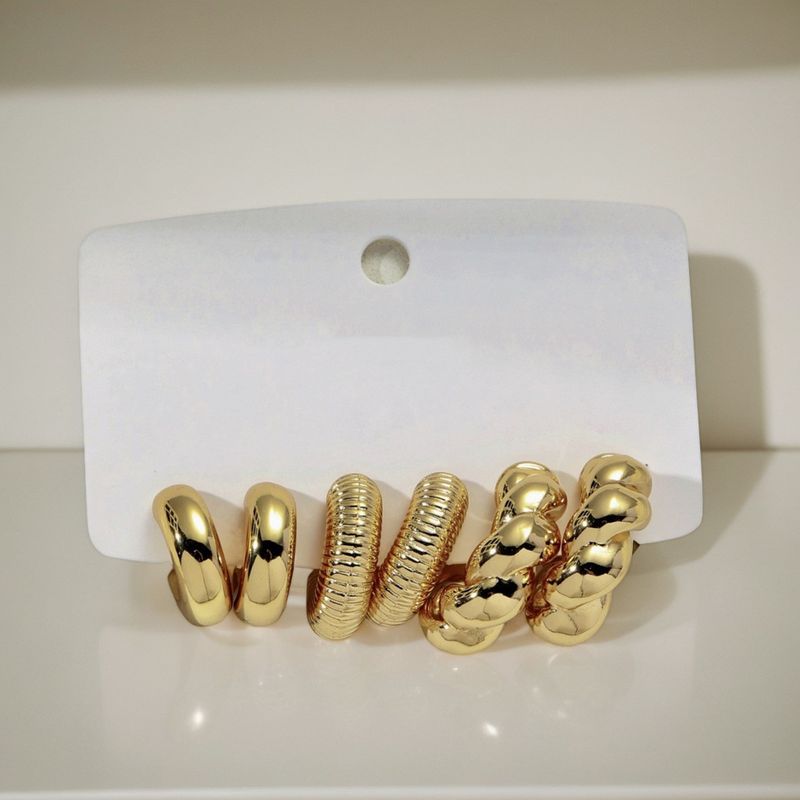 Unisex gold classic fashion personality C shaped twisted water drop shaped women's earrings set_voghion.com
