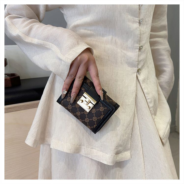 Damentaschen Geldbörse Kartenhalter Boutique Schloss Retro High-End Randdruck Dreifach gefalteter Kartenhalter mit mehreren Positionen Geldbörse mit großer Kapazität_voghion.com
