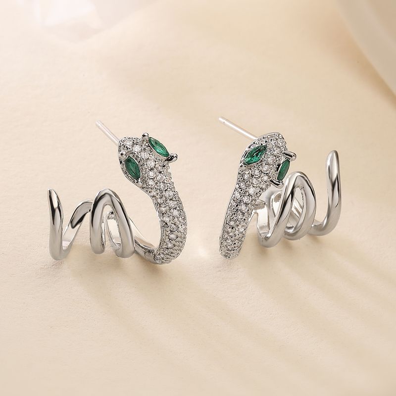 Orecchini di lusso Aogu Niche in rame placcato oro con zirconi a forma di serpente per donna, gioielli alla moda hip-hop_voghion.com