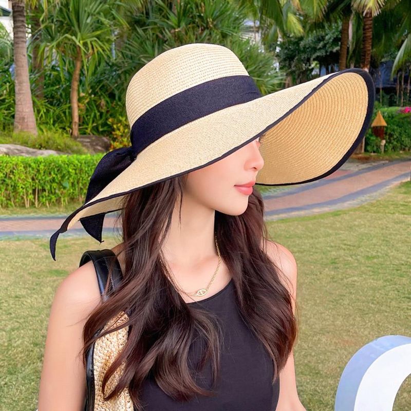 Vendita calda all'aperto Donna alla moda da mare Grande fiocco a tesa larga Protezione solare Cappello di paglia pieghevole_voghion.com