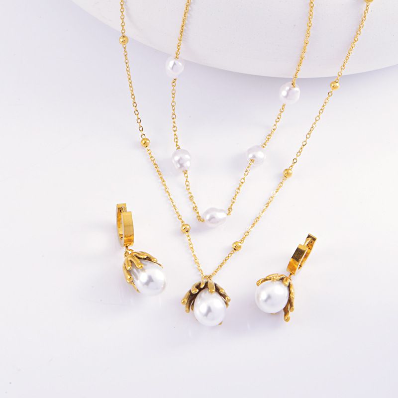 Collana con orecchini e perle intarsiate in titanio e acciaio geometrico retrò ed elegante all'ingrosso_voghion.com