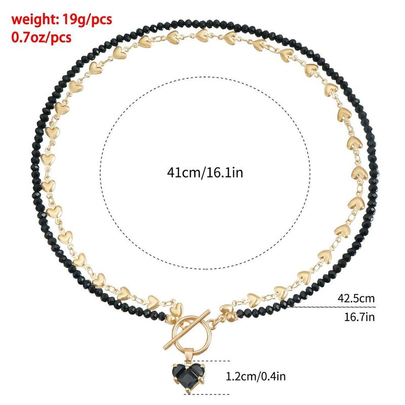 Collana da donna con ciondolo a forma di cuore con nappa, catena per clavicola con perline irregolari, design metallico alla moda_voghion.com