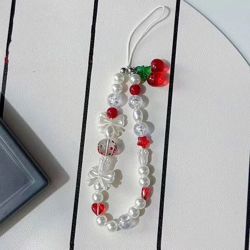 Koreansk söt röd körsbärsrosett pärla telefonkedja snodd charm rem handledspärla hängande sladd armband nyckelring för iPhone flicka rep_voghion.com