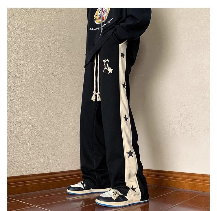 Extra große kontrastierende Kordelzug-Sporthose mit Sternen für Männer und Frauen im Frühjahr 2024 im amerikanischen Trendy Brand_voghion.com