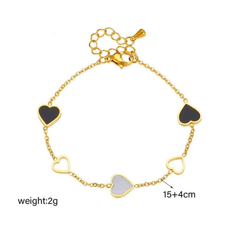 Pulsera de acero de titanio con diseño de nicho de moda, en blanco y negro, con diseño de amor hueco, sencilla y versátil para uso diario._voghion.com