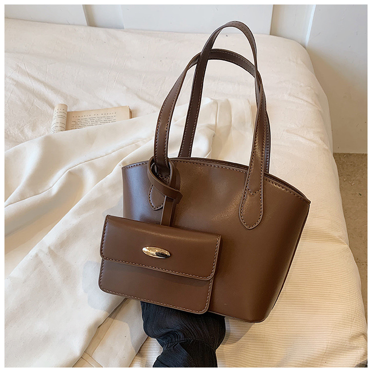 Borsa piccola portatile di moda estiva nuova borsa a secchiello casual semplice da donna 2023 borsa per ascelle suocera con trama di nicchia_voghion.com