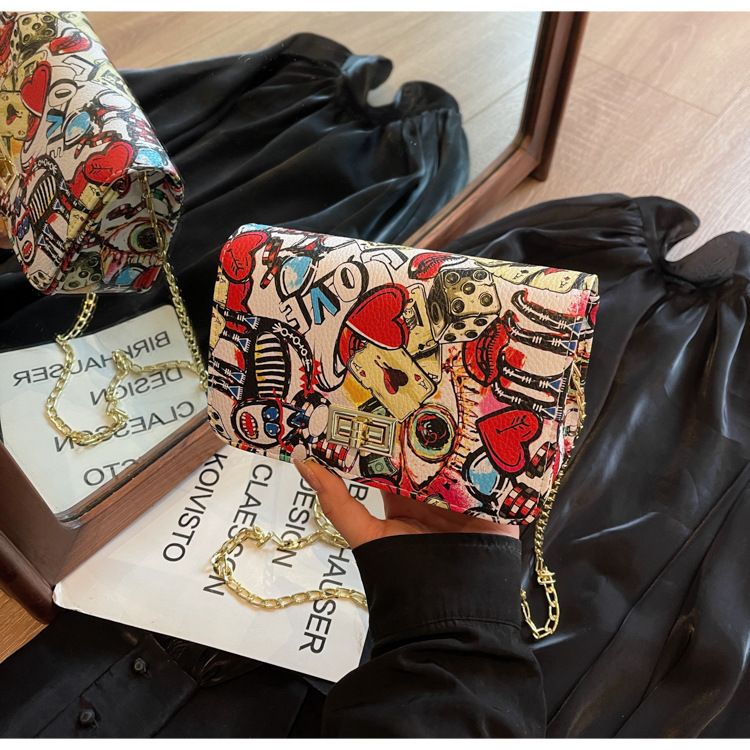 New trendy women's with Korean print style graffiti small square bag, buckle chain, single shoulder diagonal cross bag_voghion.com
