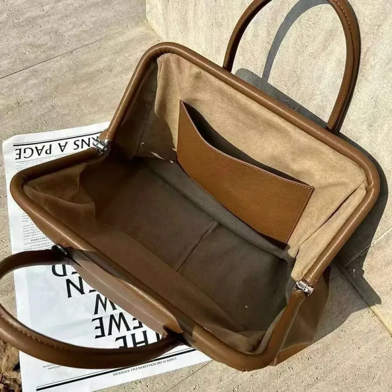 Designer 2025 New Vegetable Tanned Cowhide Shell Niche Retro Leather Clip Catfish Versatile Single Shoulder Messenger_voghion.com