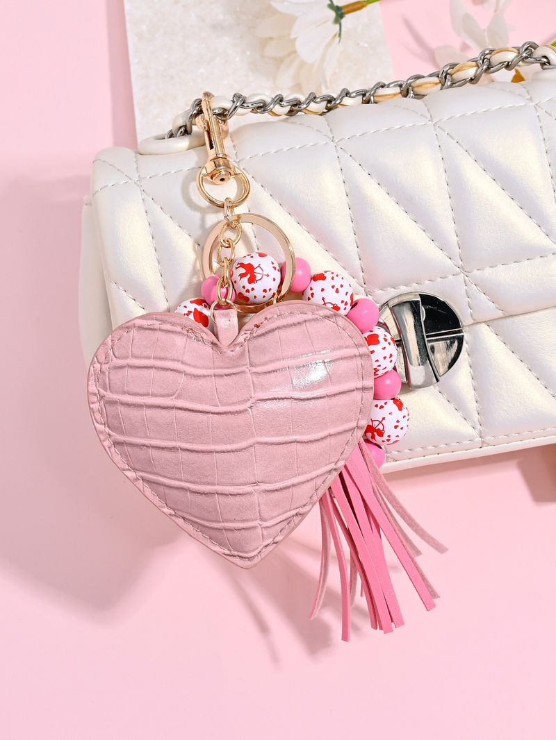 Portachiavi con braccialetto di perline di legno color leopardo, portachiavi con nappa a forma di cuore in pelle alla moda_voghion.com