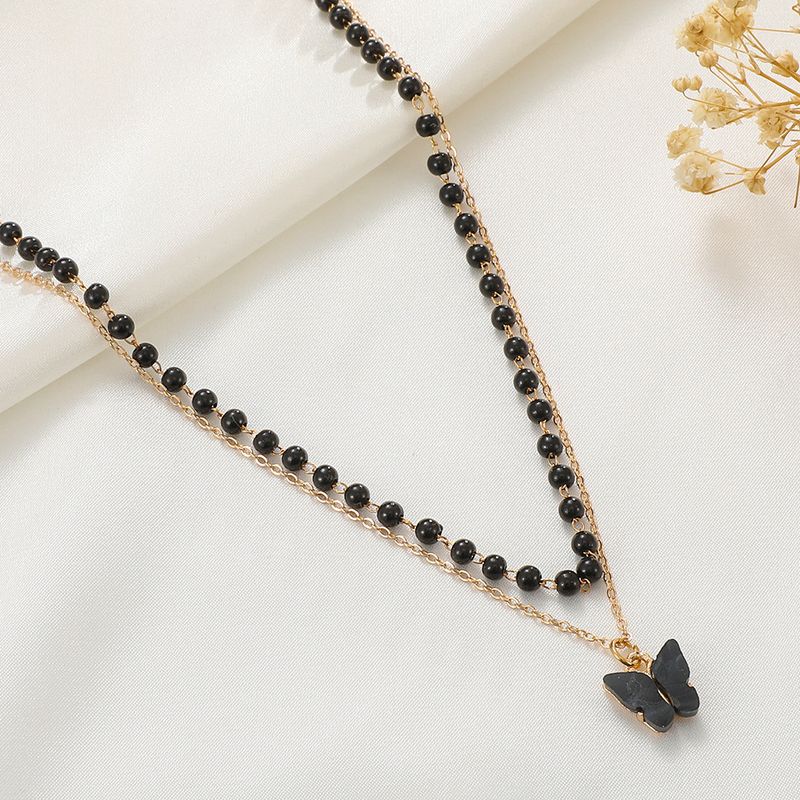 Collar con colgante de mariposa de doble capa, estilo gótico, diseño retro de nicho, cadena de clavícula con cuentas negras_voghion.com
