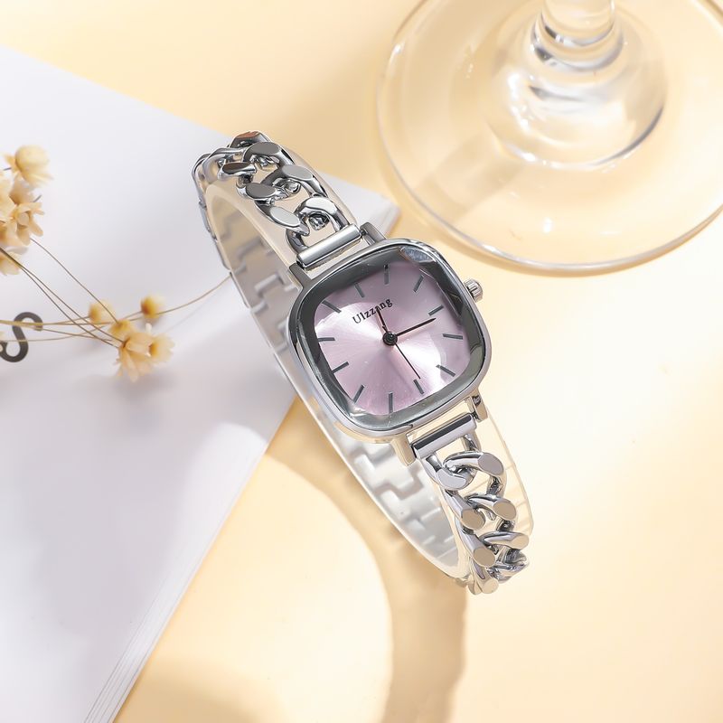 Dameur og smykkesæt med lilla Aurora-urskive og firkantet armbåndsur + armbåndssæt med sommerfuglesten til studerende_voghion.com