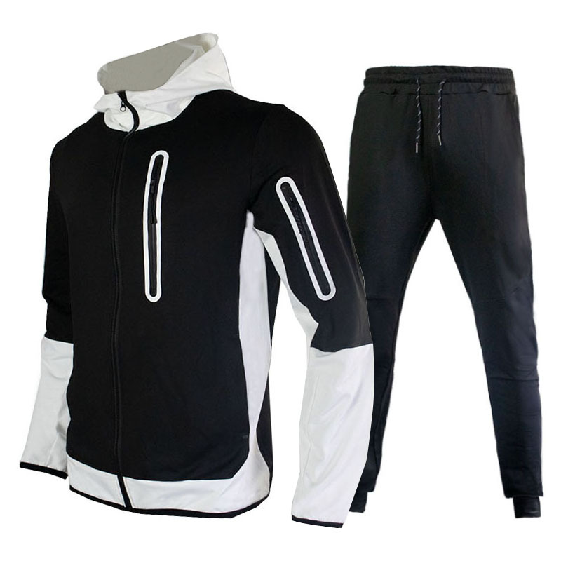 Ein Satz trendiger, lässiger Sport-Herrenanzüge mit Kapuze und farblich passenden Patchwork-Kapuzenpullovern, Jacken und Hosen_voghion.com